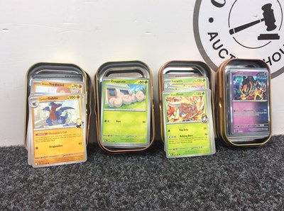 Lot 88 - 4x Pokemon tins with cards in them