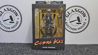 Lot 195 - Cobra Kai John Kreese action figure in display box