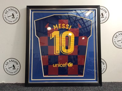 Lot 65 - Lionel Messi Former Barcelona FC football top framed bearing a signature no COA
