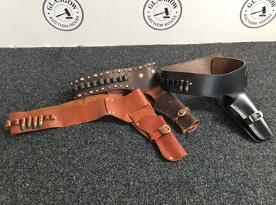 Lot 46 - 3 leather holsters with prop ammo in some slots