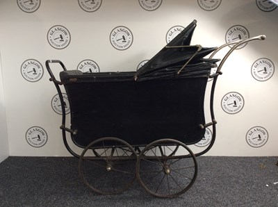 Lot 116 - Antique black pram with storage under cushion. Ideal for display