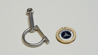 Lot 38 - 18ct mix gold mercedes keyring