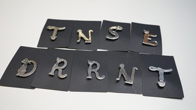 Lot 62 - 9 Silver inital brooches