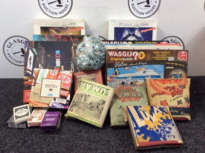 Lot 192 - Box full of jigsaws and playing cards.