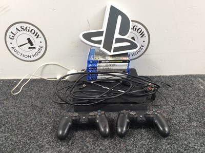 Lot 22 - PlayStation 4 With Cables, Two Controllers & Games - Used