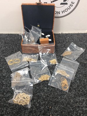 Lot 127 - Small brown case with costume Jewellery and rings inside.