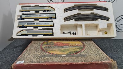 Lot 36 - 2 boxes containing various model trains and tracks by Hornby