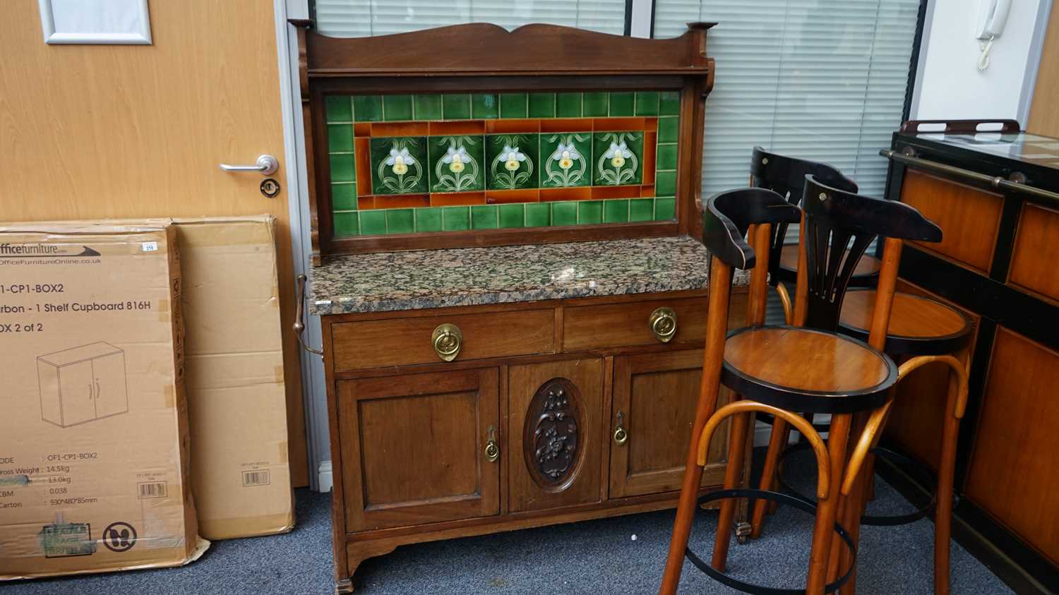 Lot 211 - Marble top tile back carved front dresser