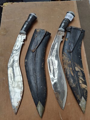 Lot 166 - Two vintage gurkha style knifes in leather sheath