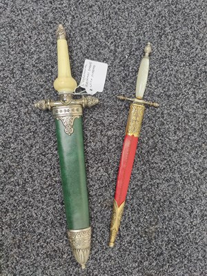 Lot 178 - Pair of ceremonial kashmiri daggers with decorative green and red scabbards