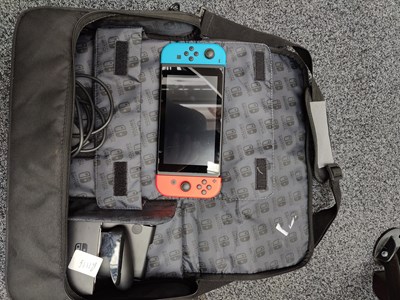 Lot 76 - Nintendo switch with accessories including case and charger