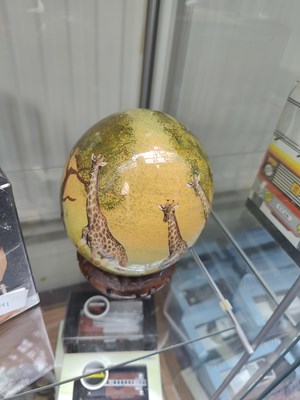 Lot 113 - Hand Painted Ostrich Egg on stand