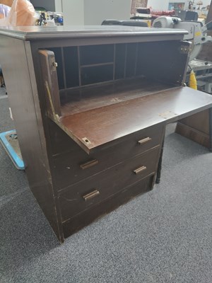 Lot 270 - 4 drawer with opening front writing desk in dark wood