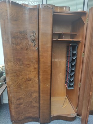 Lot 171 - Large gents bow front wardrobe with labeled internal sections and working lock. Walnut veneer