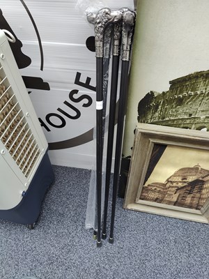 Lot 127 - 4 dog head walking sticks