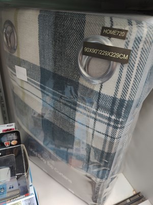 Lot 76 - Curtains in blue check design with ring top