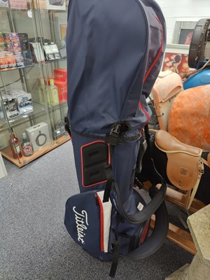 Lot 114 - Titleist navy blue golf bag with stand including club cover