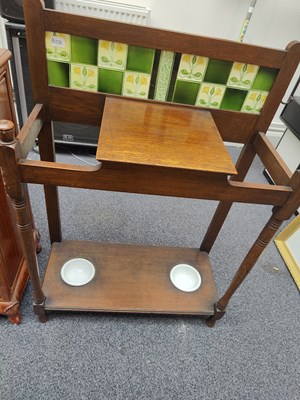 Lot 119 - Hall table in wood with green tile splash back