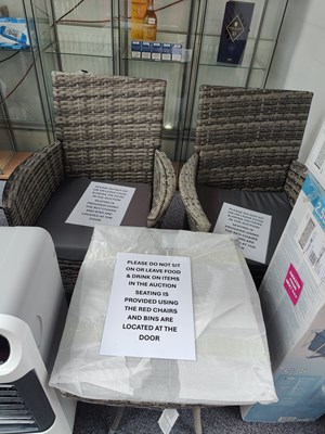 Lot 123 - Ratan style glass top table with 2 chairs and grey seat cushions