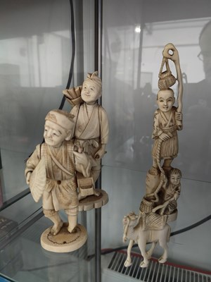Lot 103 - 4 bone figurines comprising 3 Asian people and an elephant