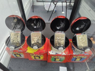Lot 142 - 1999 Pokemon 23k gold trading x4 ( mewtwo, Pikachu, poliwhirl, and togepi) from burger king promotion very collectable