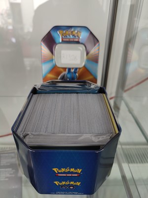 Lot 87 - Qty of Pokemon cards GO in tin
